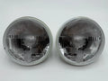 Pair of round 7in BMW 2002 headlights on a white background