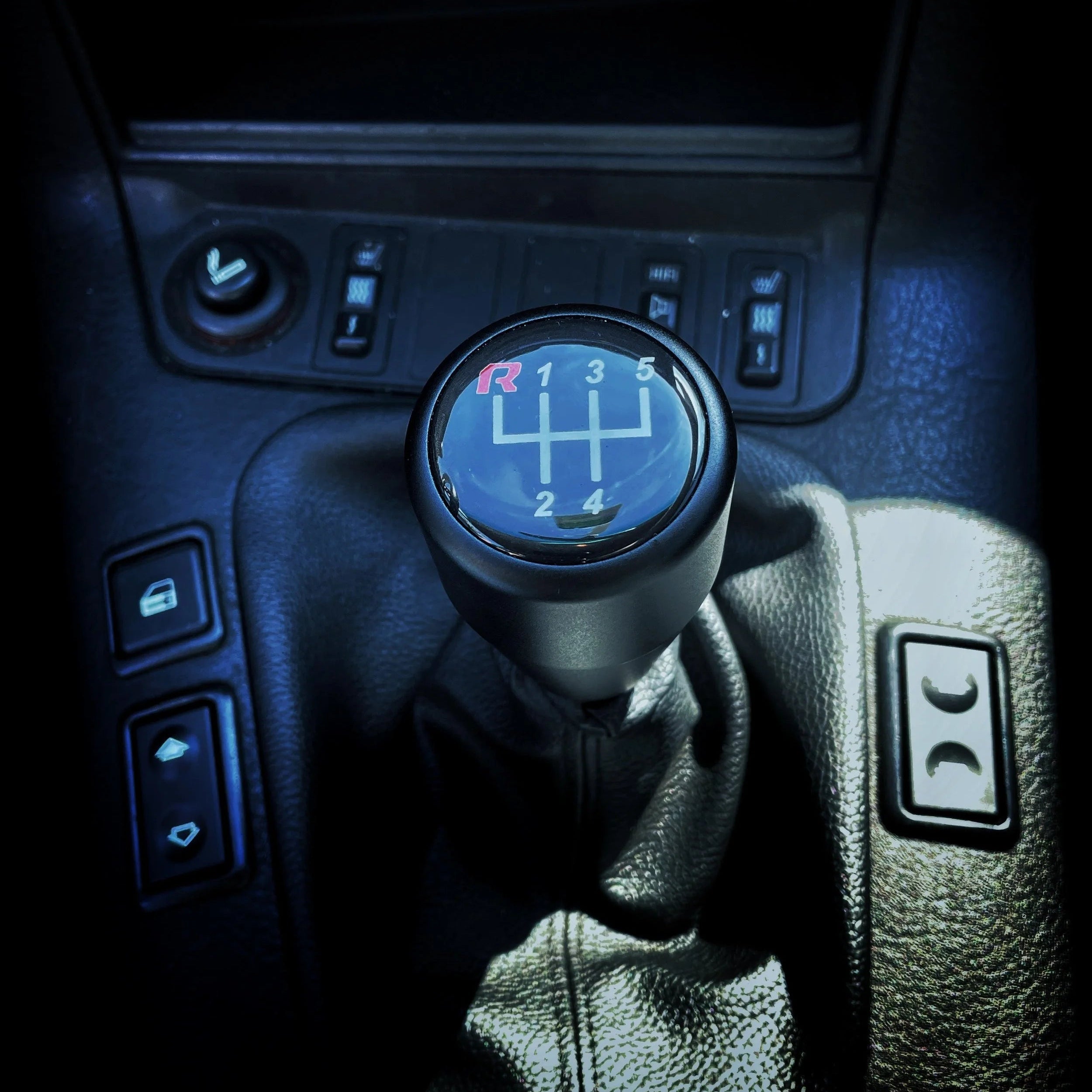 Close-up of a BMW gear shift lever with an HRB Black shift knob