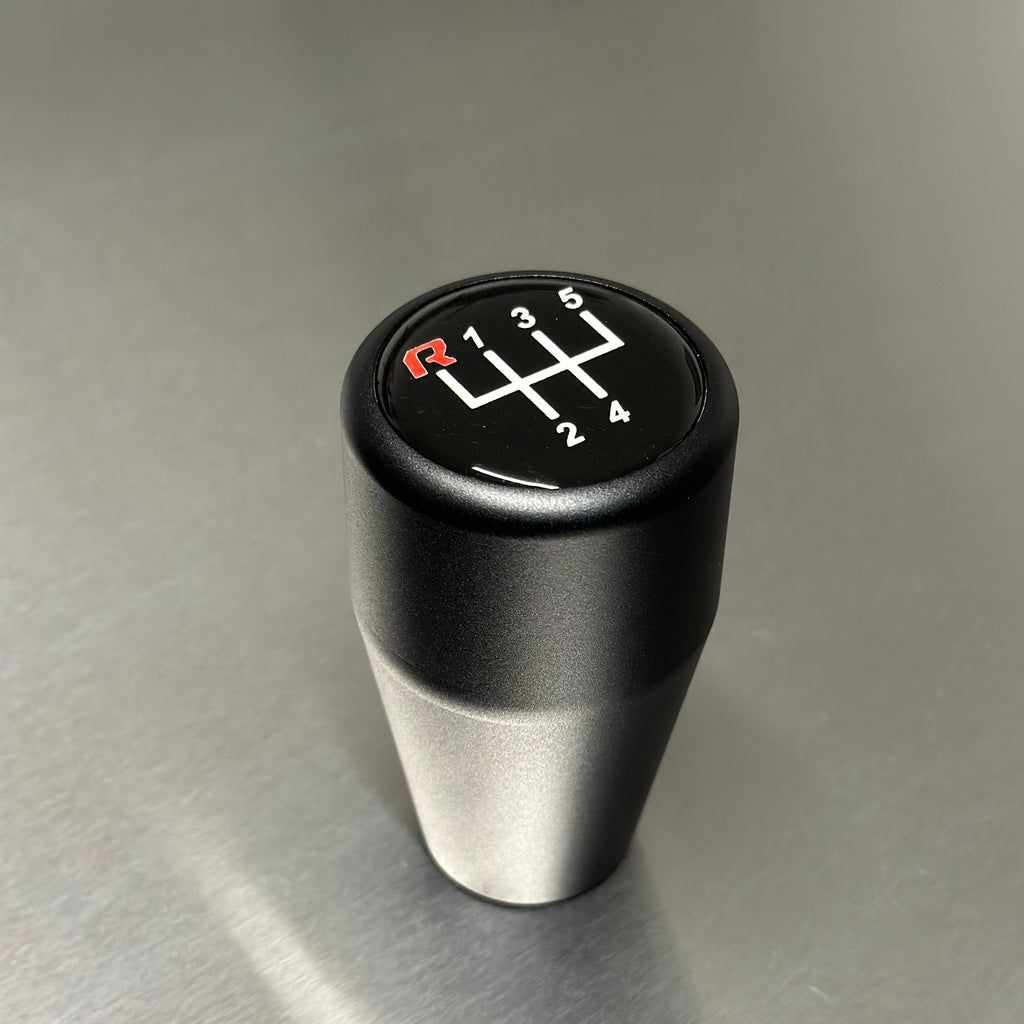 HRB BMW gear shift knob with six-speed symbol on a metallic surface