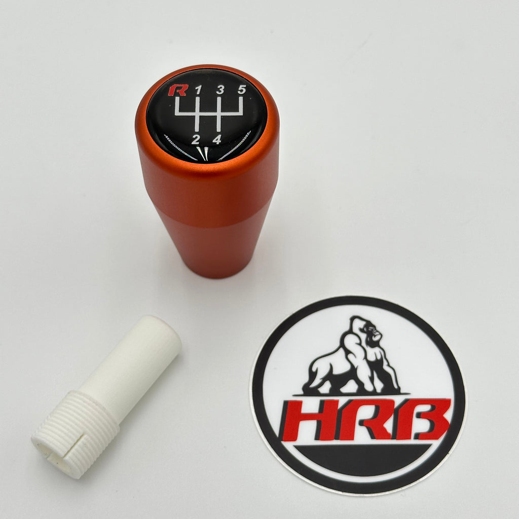 Hrberformance Orange gear shift knob with a sticker featuring 'HRB' logo on a white background