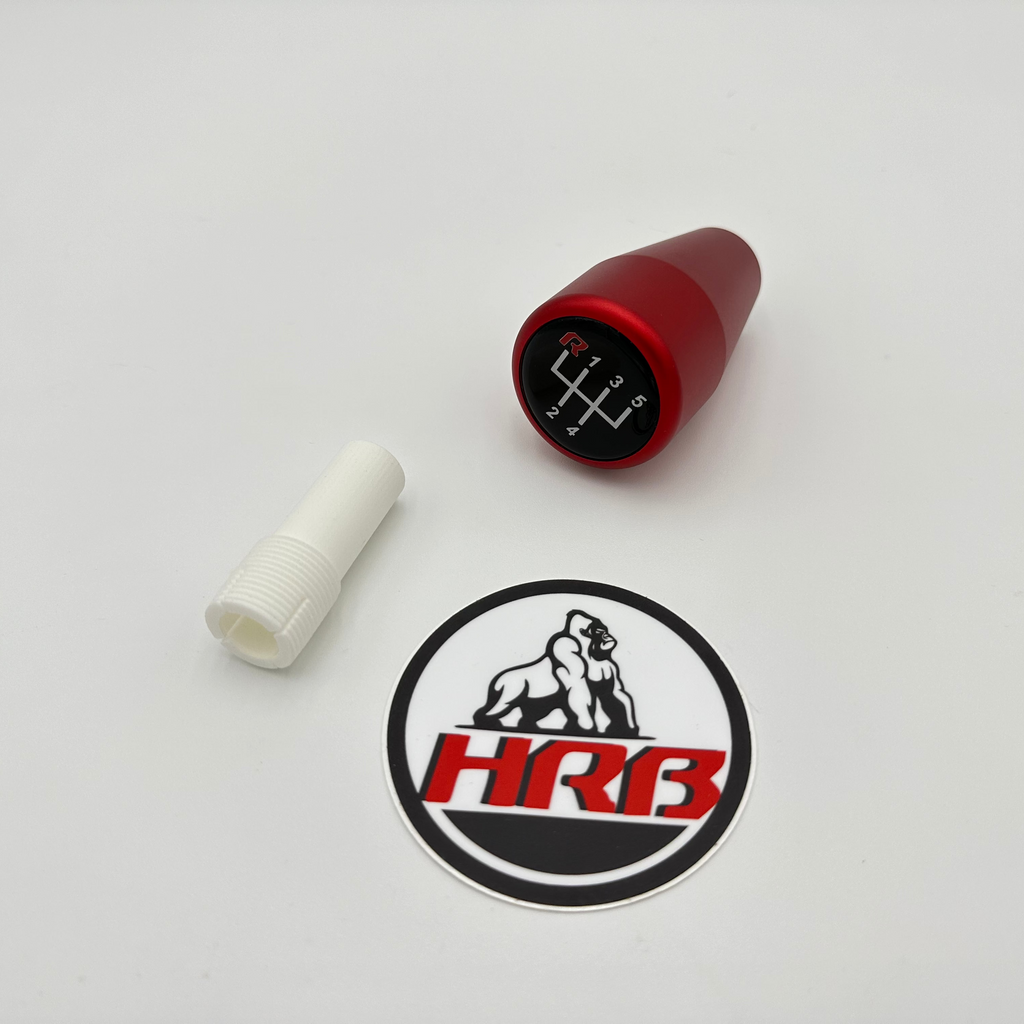 Red gear shift knob with a white sleeve and HRB logo on a light gray background, designed for BMW