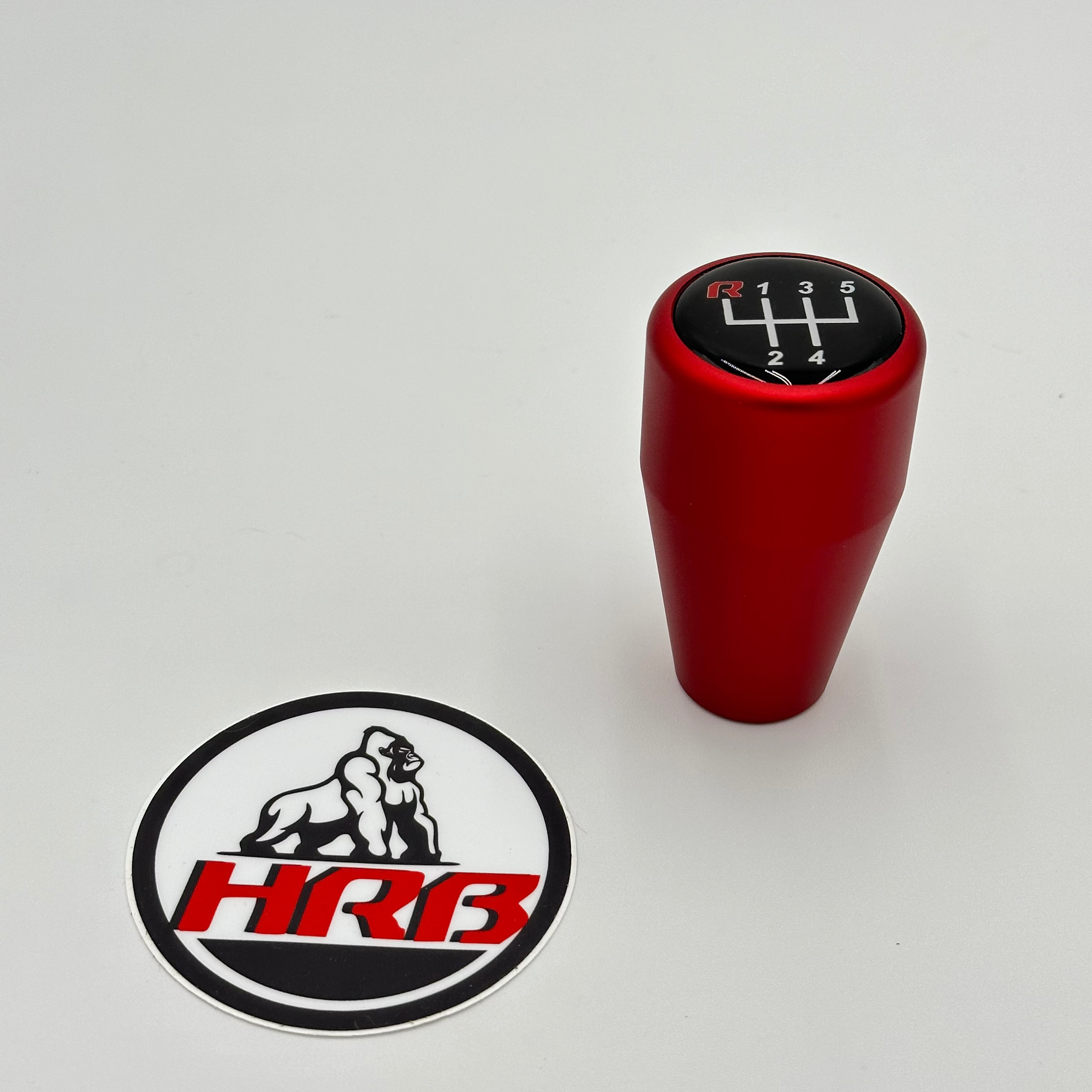 HRB anodized red gear shift knob with a logo on a gray background for BMW