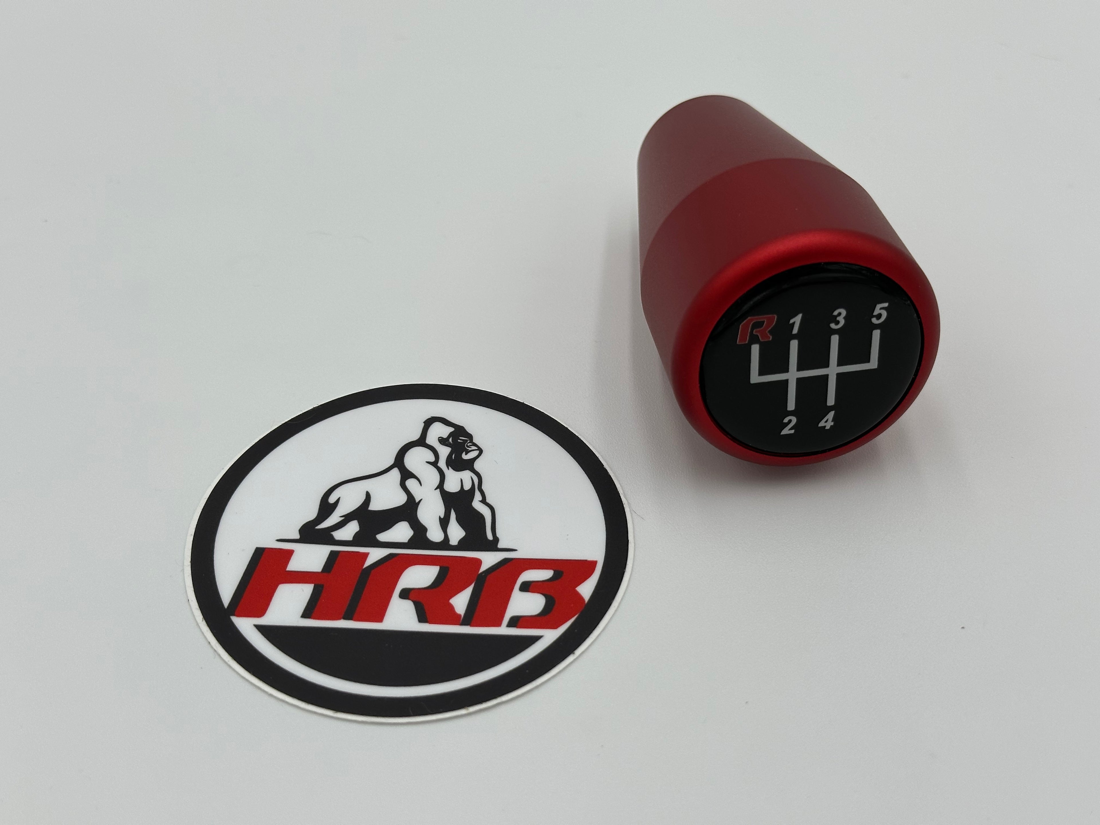HRB Red gear shift knob with black and white 'HRB' logo on a white background