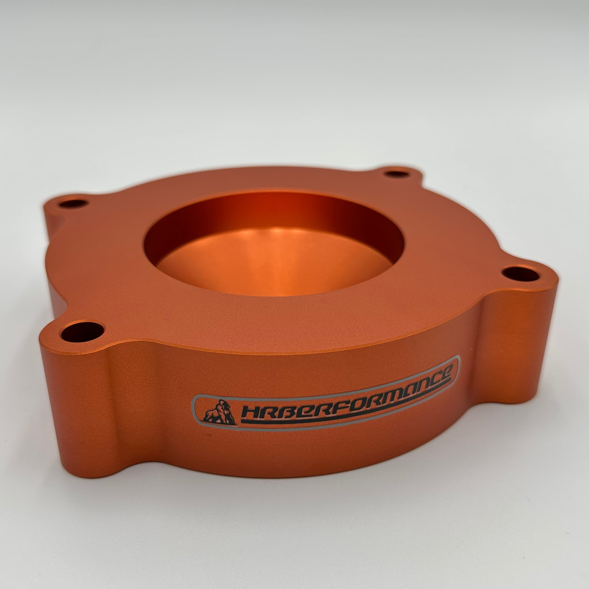 Orange anodized HRB Lift kit front with a brand logo on a white background