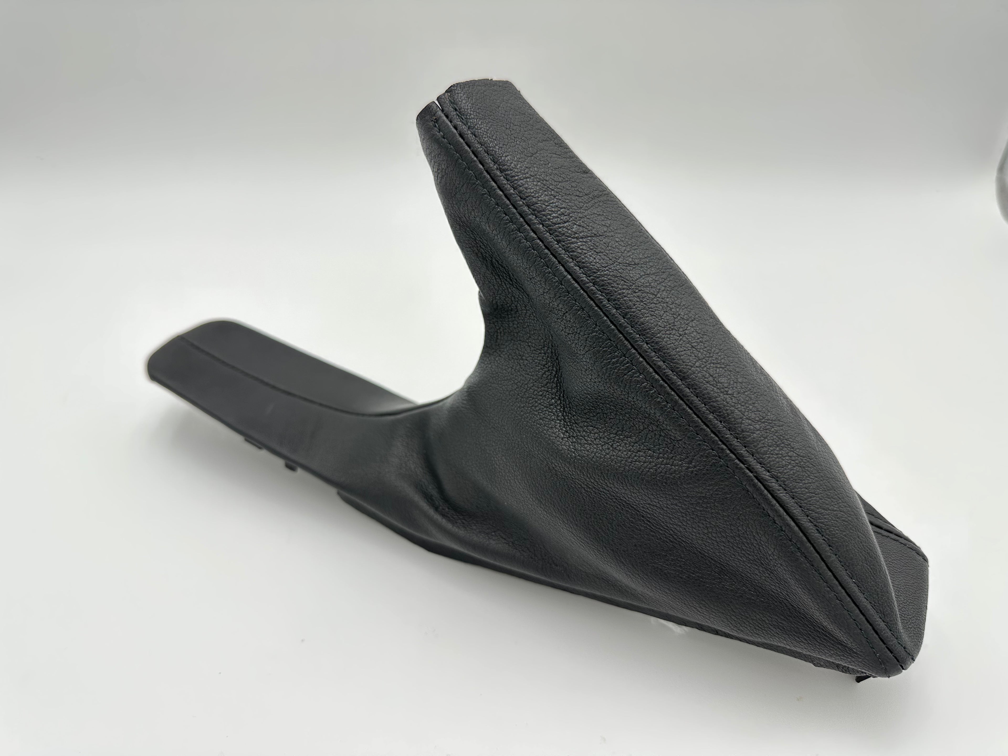 Black leather BMW E-brake boot on a white background
