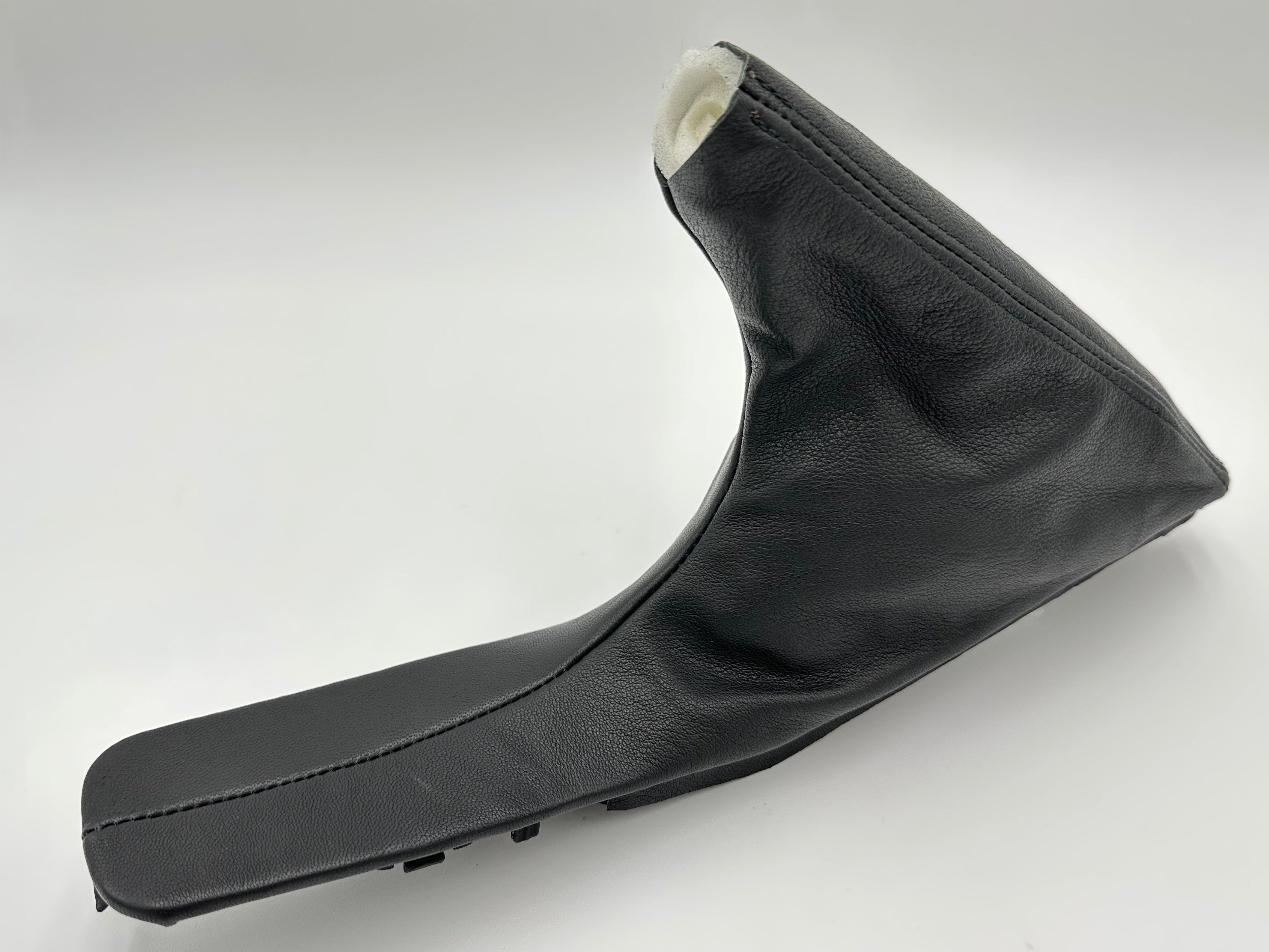 Black BMW e-brake shift boot on a white background